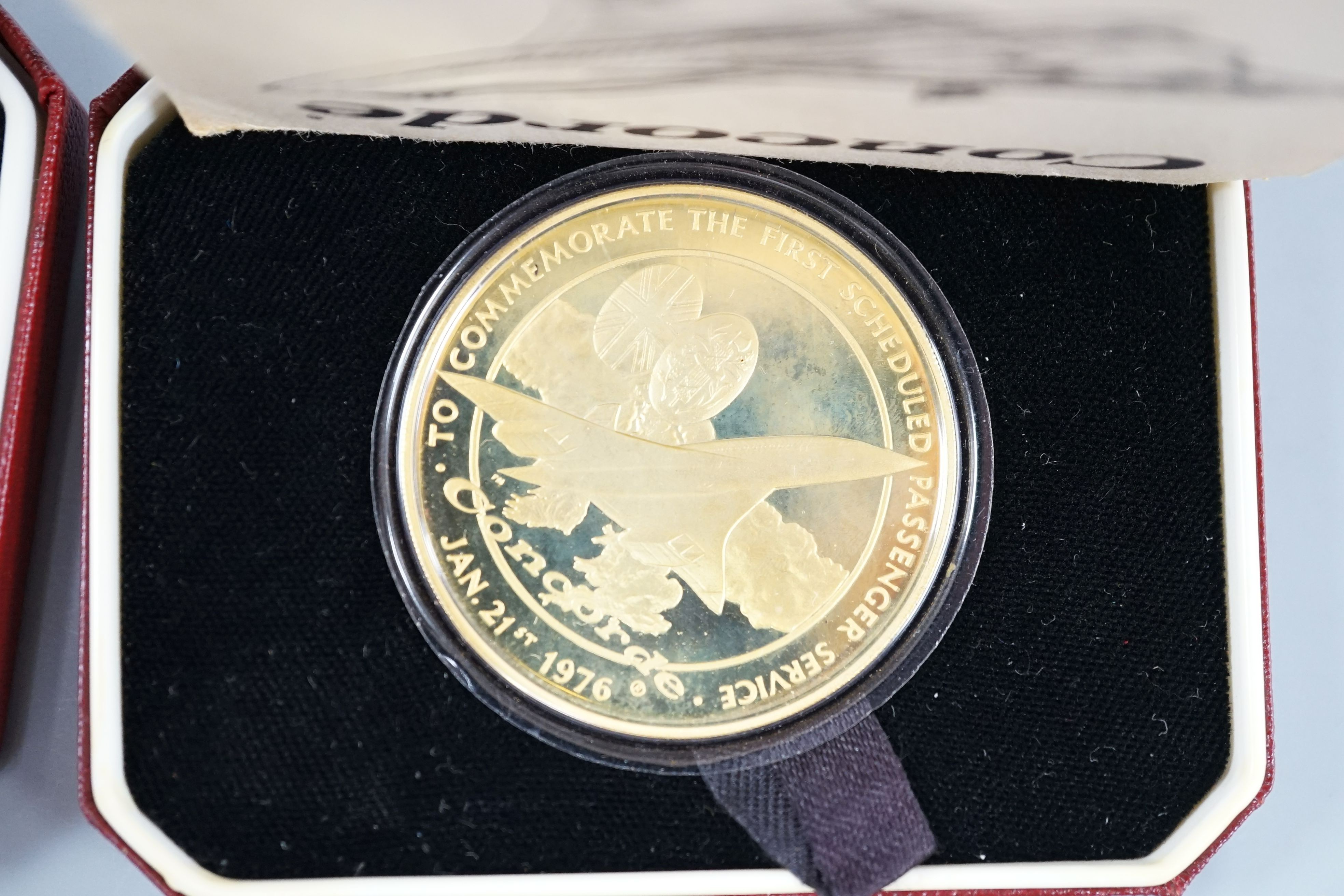 Five assorted cased Pobjoy Mint silver gilt Crown medals struck to commemorate first flights of Concorde, with certificates